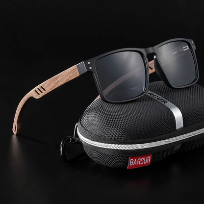 Sunglasses with wooden arm on a black case, against a black background